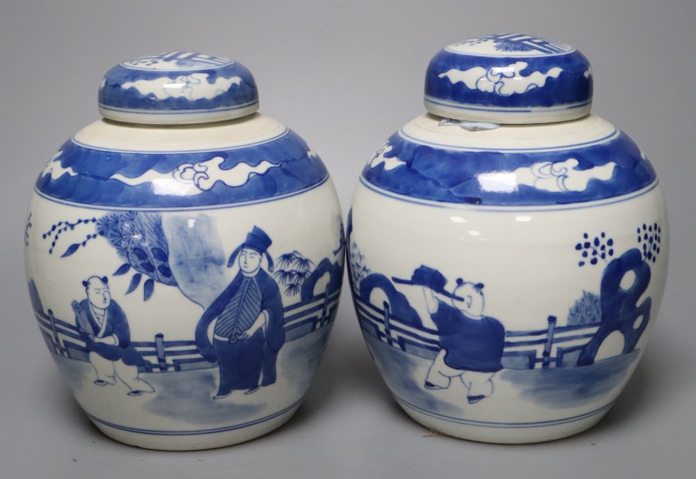 A pair of Chinese porcelain blue and white jars and covers, Qianlong marks but c.1900, 18cm high